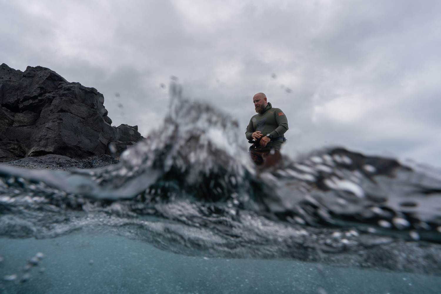 Diver entering the water off Kona